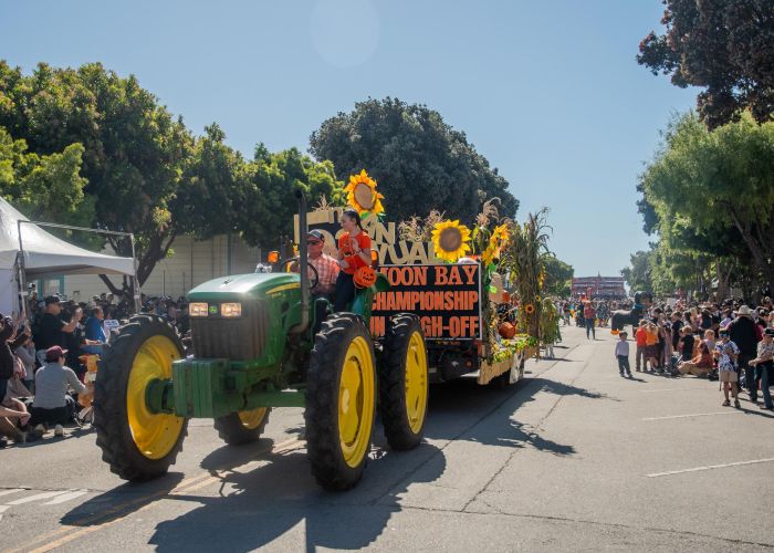 Local farmer pulling parade float